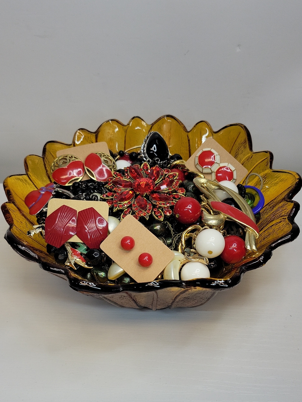 Amber Glass Bowl Filled With Jewelry